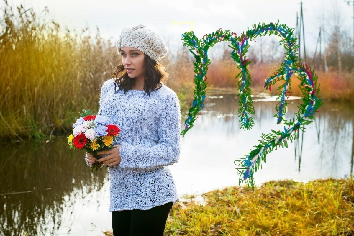 mulher do signo de virgem segurando flores nas mãos